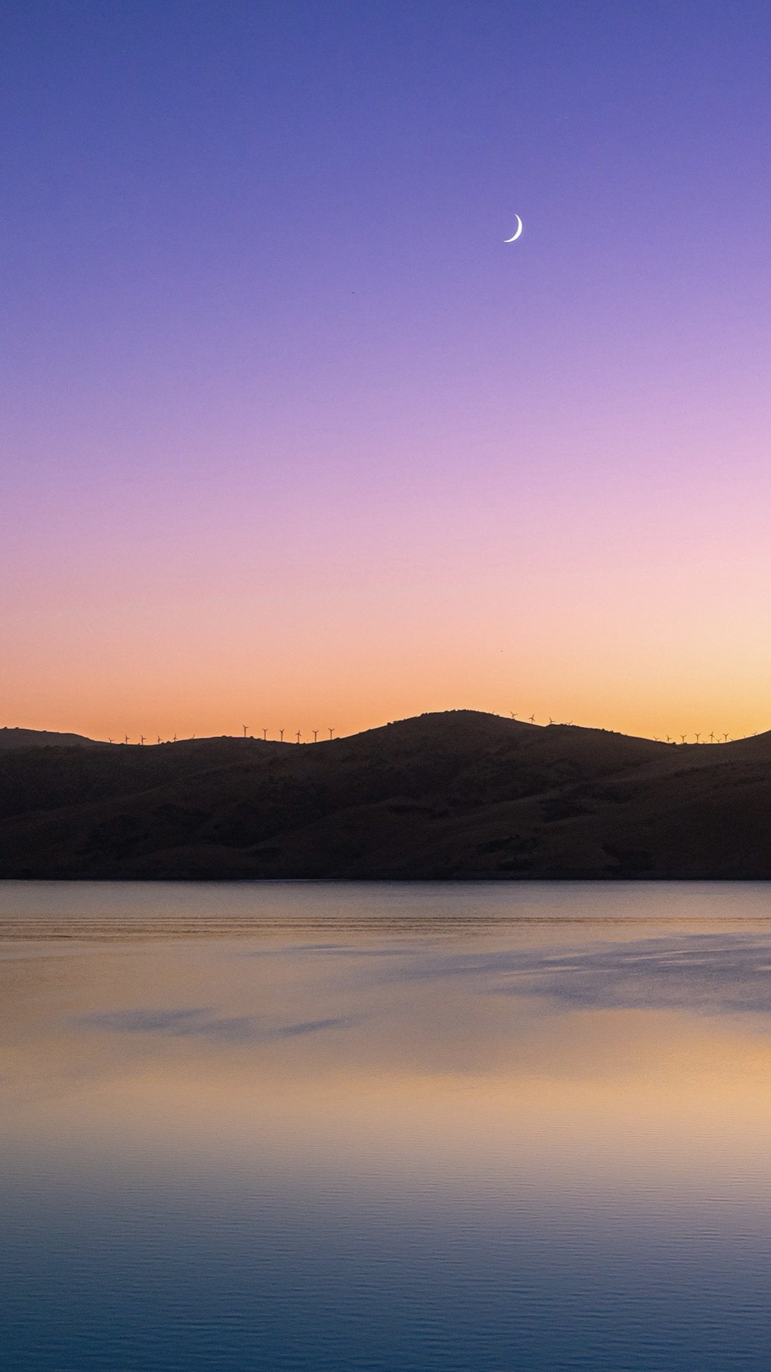 Pastel sunset over a reservoir